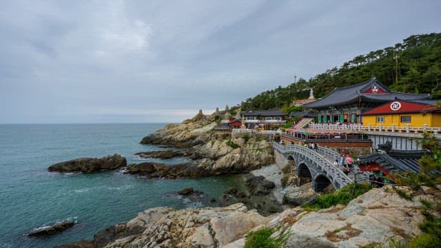 Haedong Yonggungsa Temple in Busan, located on the coast on a cloudy day, from day to night