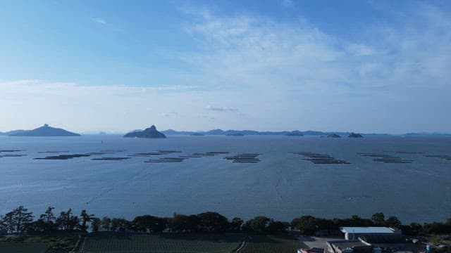 Coastal View with Aquaculture and Farm Landscape
