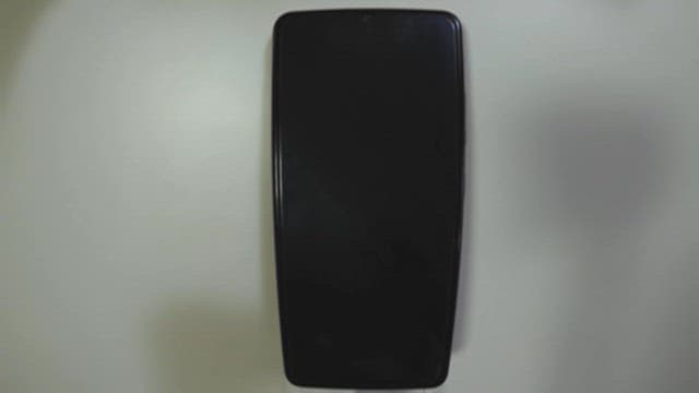 Person using a smartphone indoors