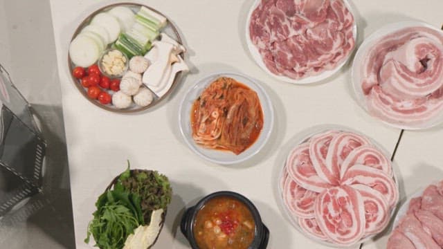 Various cuts of fresh pork on plates