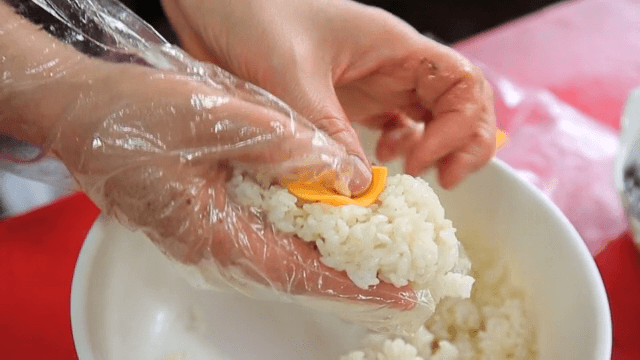 Preparing rice balls with cheese