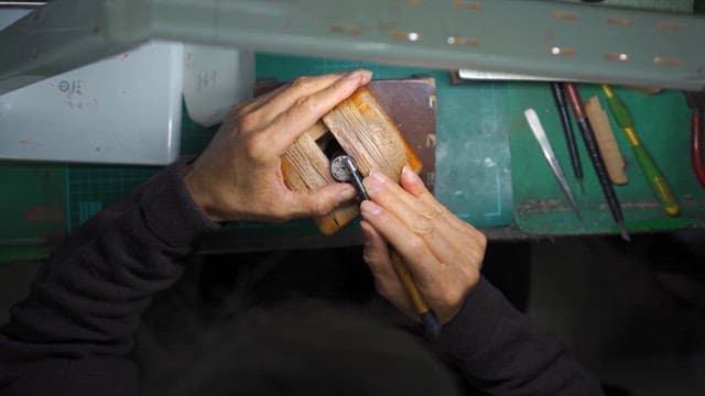 Artisan Carving Intricate Designs in Workshop