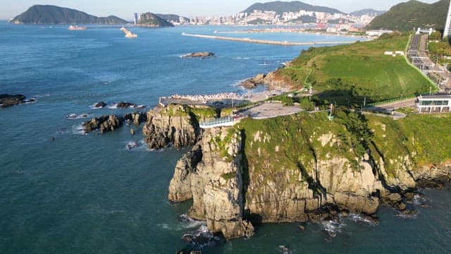 Coastal cliffs with city skyline