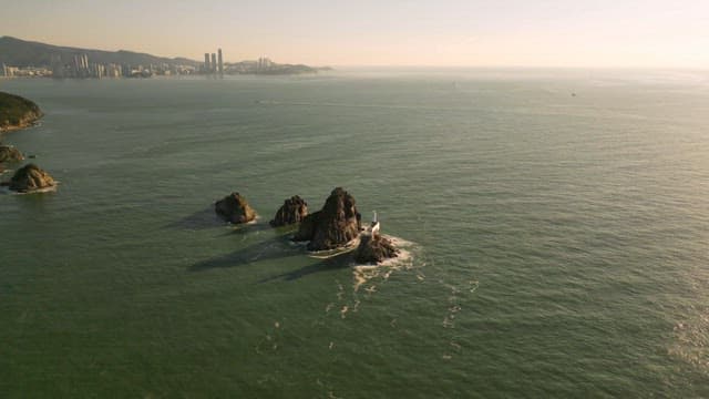 Rocky island surrounded by calm sea