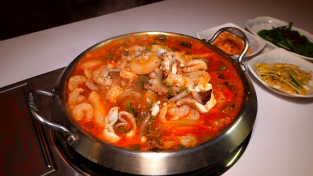 Steaming Spicy Seafood Stew with Various Vegetables