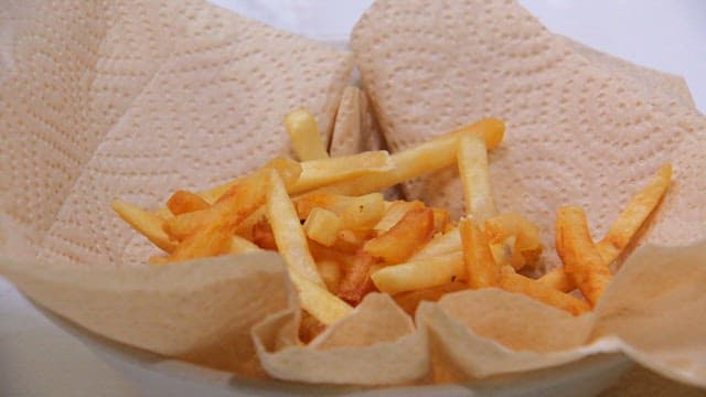 French fries on paper towels