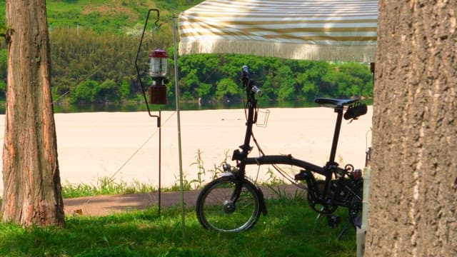 Bicycle parked under a tent