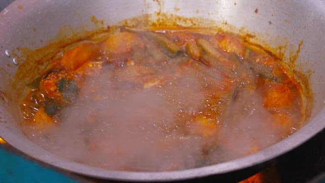 Braised fish and radish boiling in a pot