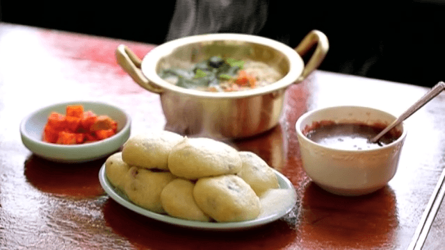 Steamy Traditional Korean Meal on a Table