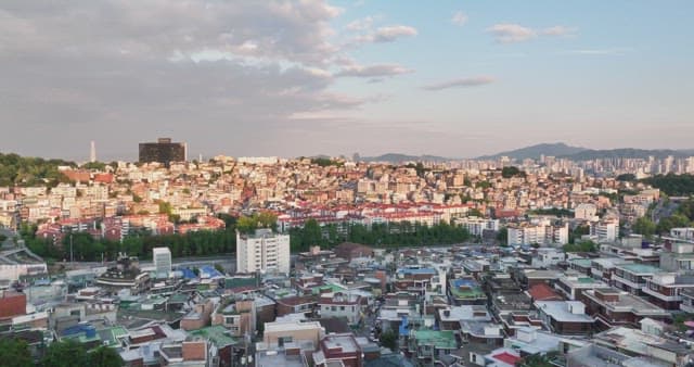 Sprawling cityscape under a cloudy sky