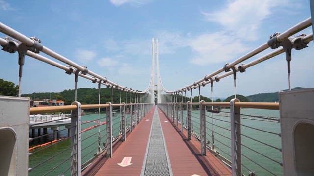 Pedestrian Bridge in Waterside park on a sunny day
