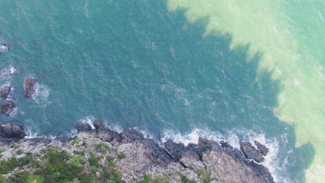 Waves crashing on rocky coastline