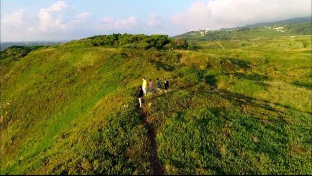 People walking along the beautiful coastal cliff walk at Cabo da Roca