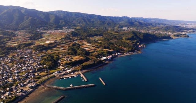 Coastal village with mountains and sea