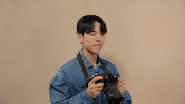 Man taking pictures with a DSLR camera