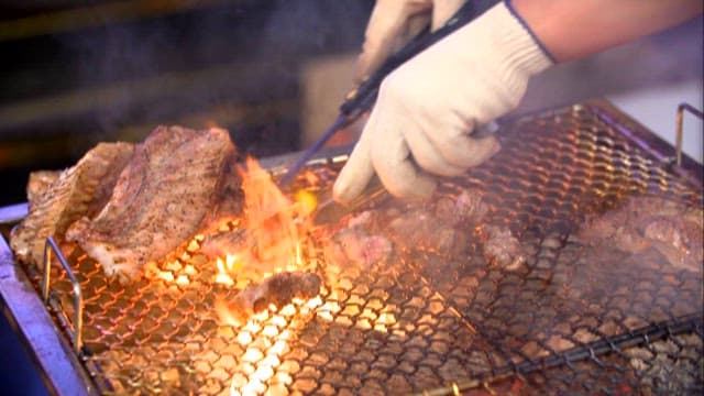 Sizzling Meat Over Charcoal Fire