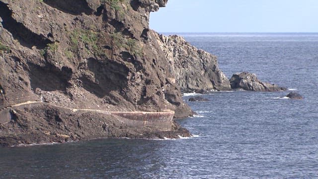 Coastal cliffs and walkway by the sea