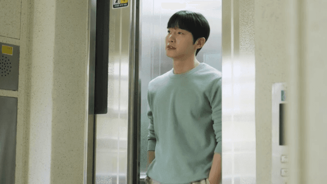 Man getting out of an elevator in an apartment building