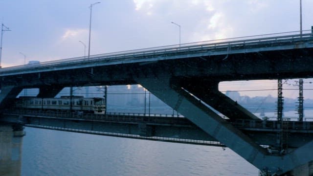 Subway Passing Under a City Bridge over Han River