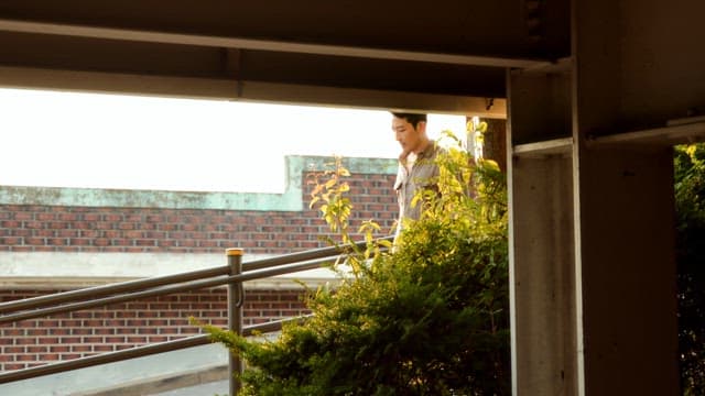 Man walking down a ramp outdoors