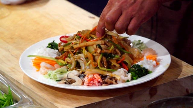 Egg yolk on top of starch sheet salad with mustard sauce