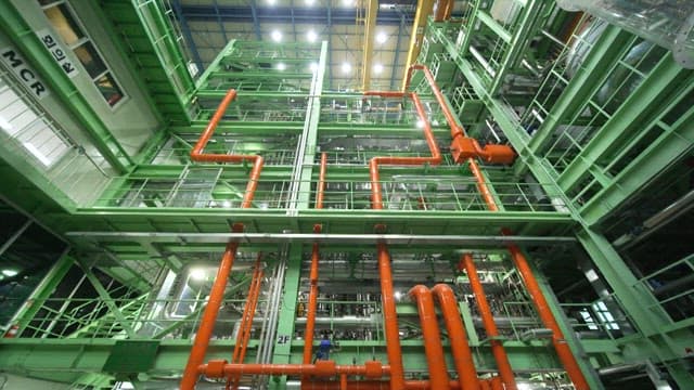 Modern industrial machinery with pipes and platforms