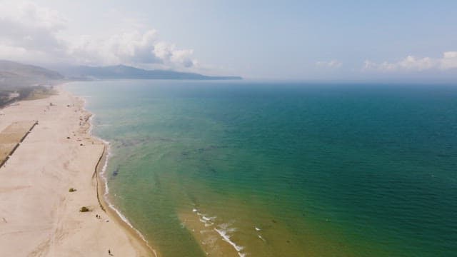 Aerial view of a serene beach and ocean