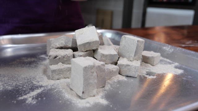 Powdered chocolate dessert stacked on a plate