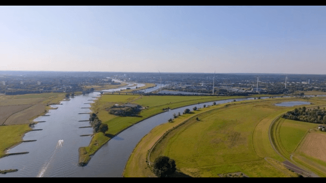 River winding through green fields