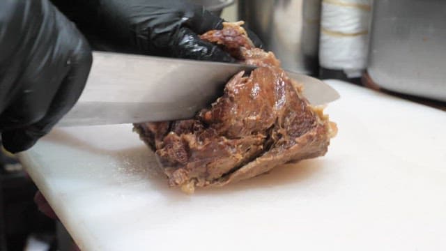 Person who cuts moist cooked meat