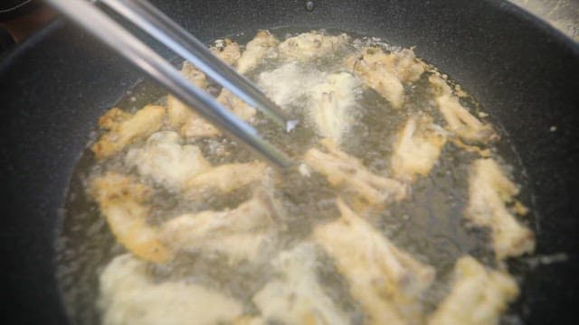Frying oyster mushrooms in a pan with oil