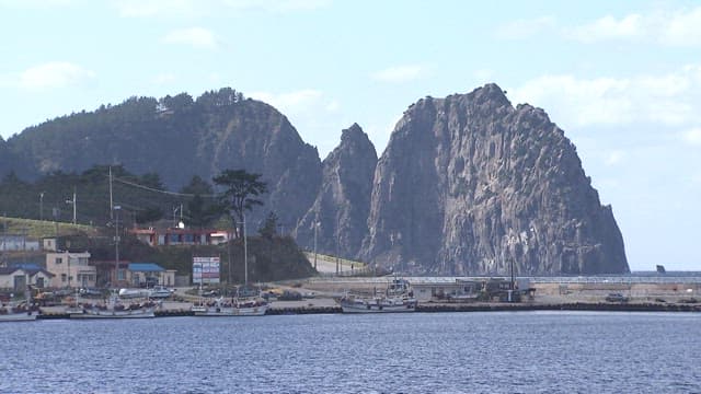Coastal Village with Huge Rock Cliffs
