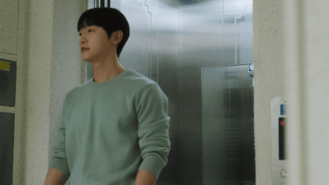 Man getting out of an elevator in an apartment building