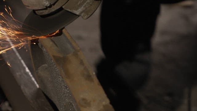 Sparks flying from a grinder on metal