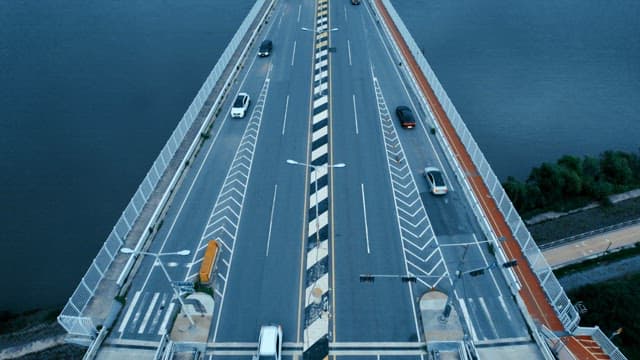 Cars driving on a bridge over river