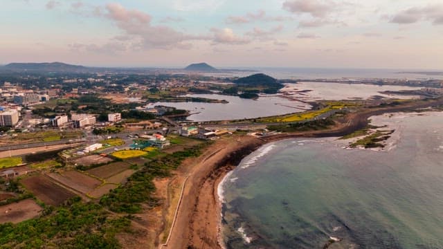 Coastal cityscape with distant mountains