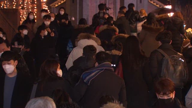 Crowd of People Walking in Illuminated Night Area