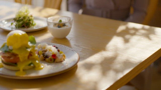 Placing Plates of Food on the Brunch Table