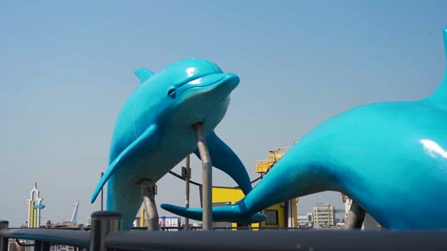 Dolphin sculpture at a city park