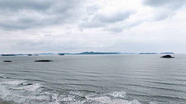 Calm sea with distant islands