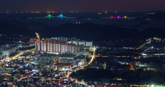 Night view in Changwon with brightly lit buildings and bridges