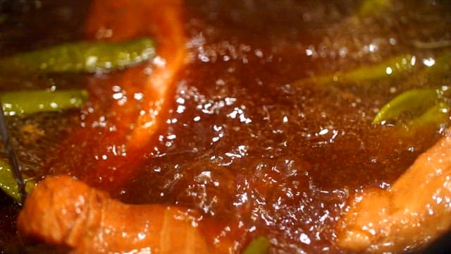 Pork cooked in a broth with spices