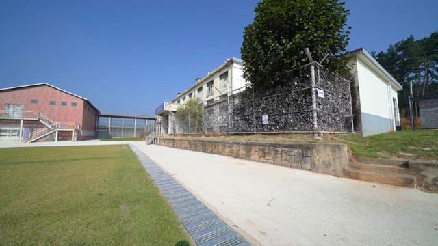 Peaceful Prison Yard under clear skies