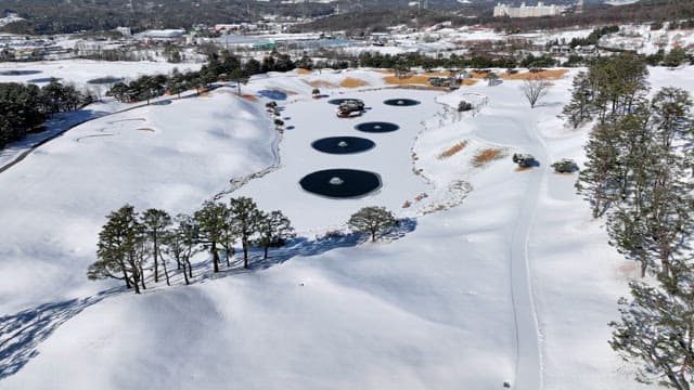 Snow-covered Landscape with Ponds