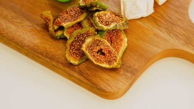 Gourmet Cheese and Figs on a Wooden Board