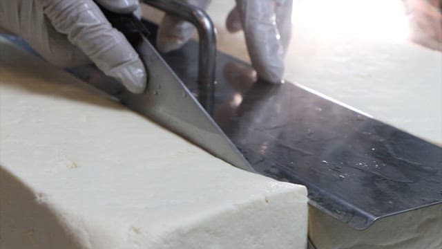 Hot tofu being prepared in a restaurant kitchen