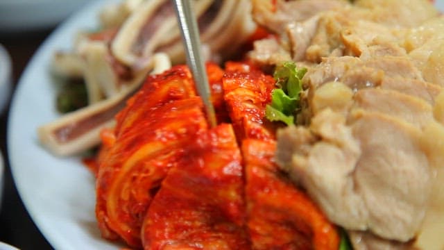 Korean boiled pork and kimchi on a plate