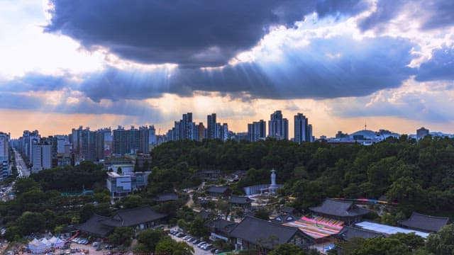 Sunset of the temple complex with the buildings in the background