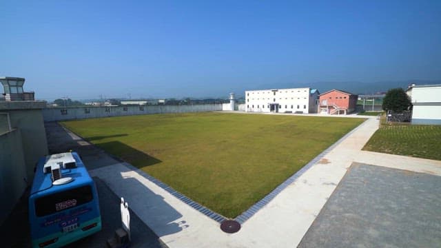 Peaceful Prison Yard under clear skies