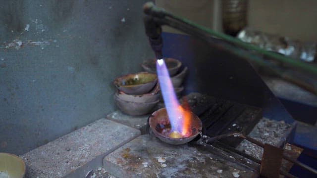 Artisan Heating Metal in a Forge